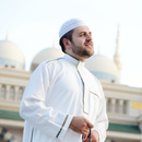 Man in traditional clothing using a phone